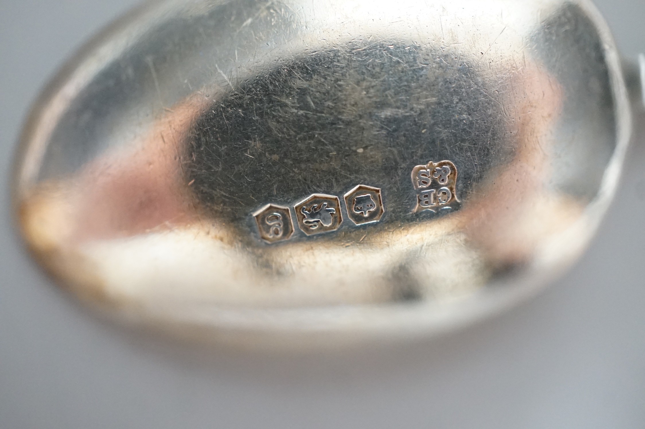 A set of six George V silver seal top coffee spoon, cased, and a pair of George V silver old English pattern fruit spoons, Sheffield, 1916, cased.